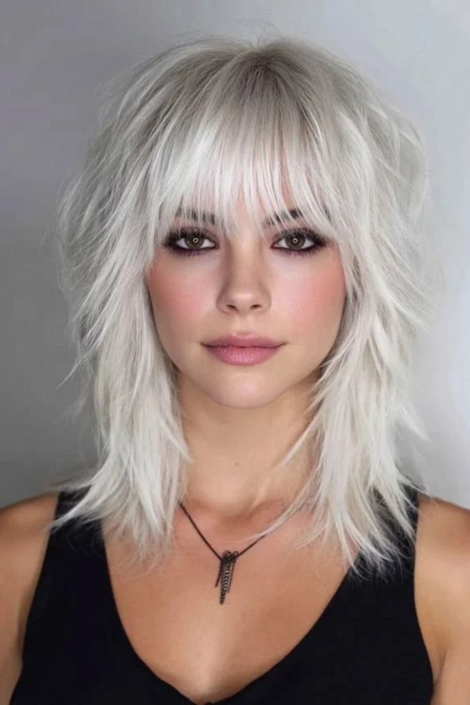 Silver shimmer jellyfish haircut with layers.