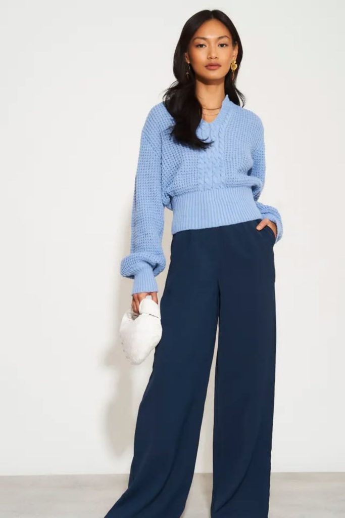 Navy trousers with blue sweater.