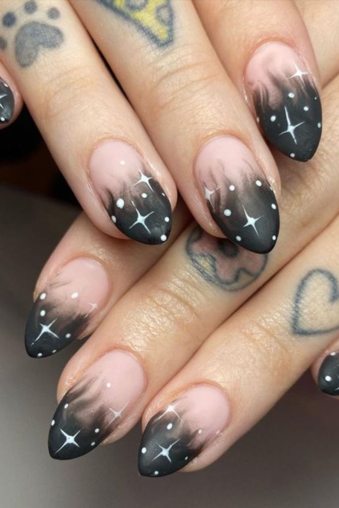 Smoky crystal nails with silver accents.