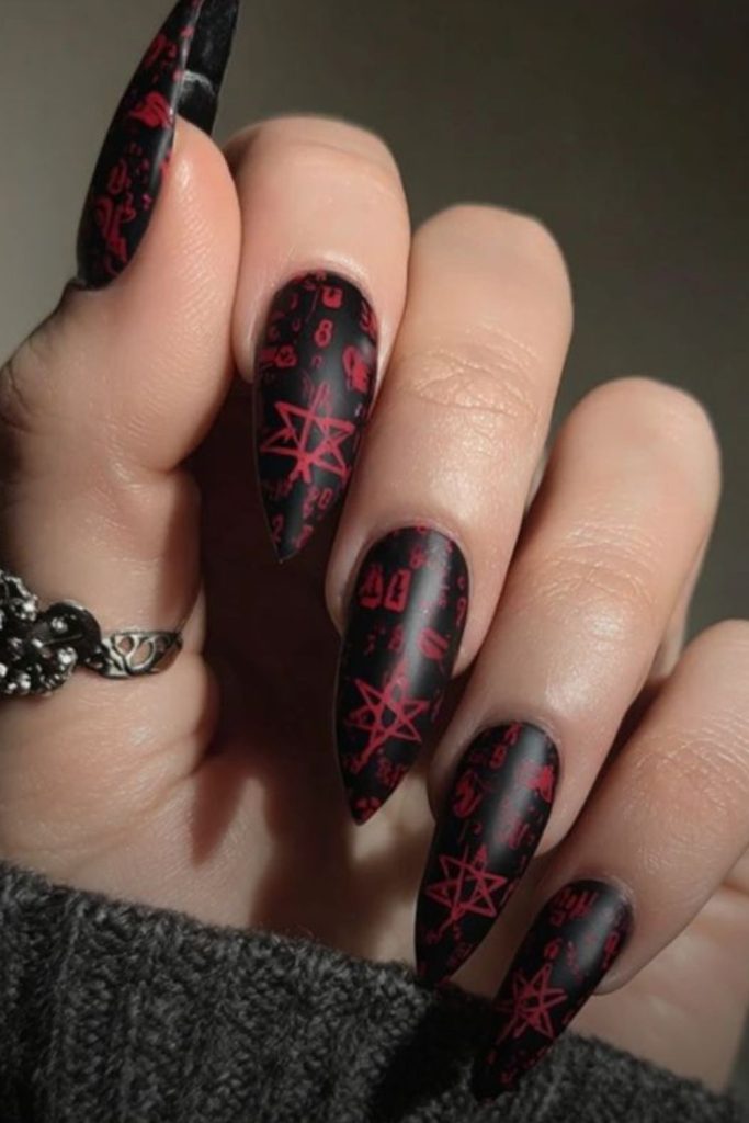 Spellbook nails with mystical handwritten symbols.