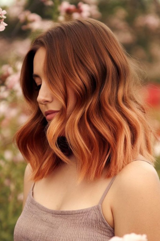 Strawberry brunette ombré with warm ends.