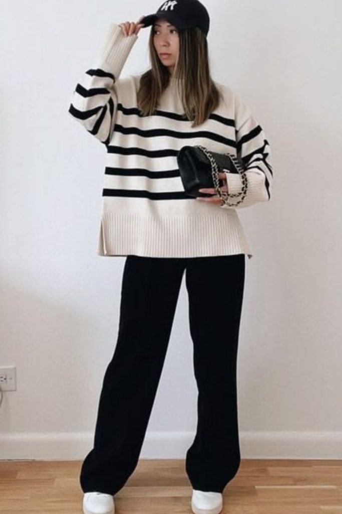 Relaxed black trousers casual outfit.