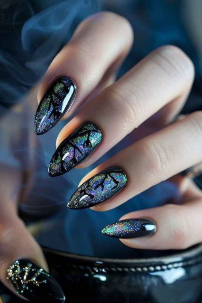 Black glitter nails with silver moons.