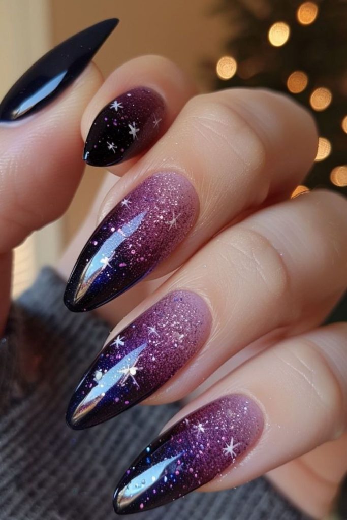 Black plum ombre nails with stars.