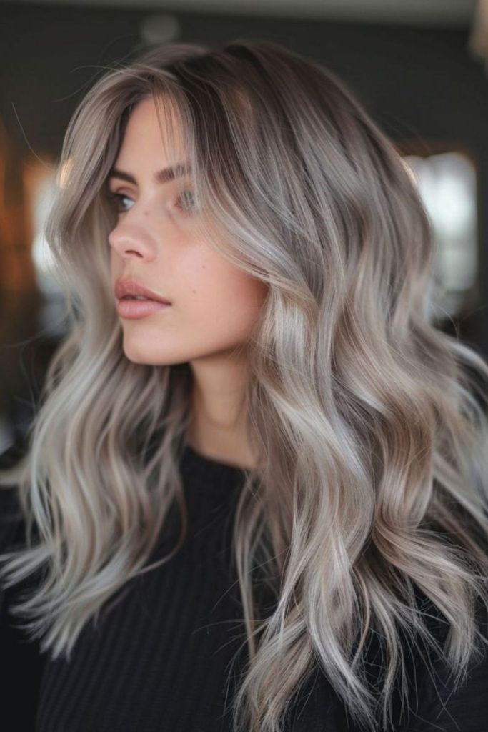 Ash bronde hair with smoky highlights.