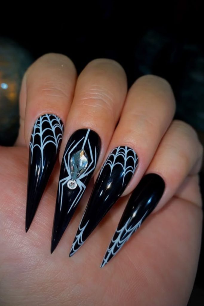 Black silver web stiletto nails.
