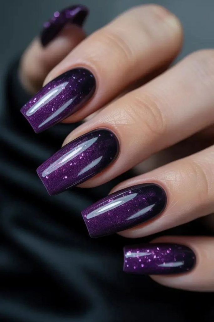 Rich blackberry plum glossy nails.