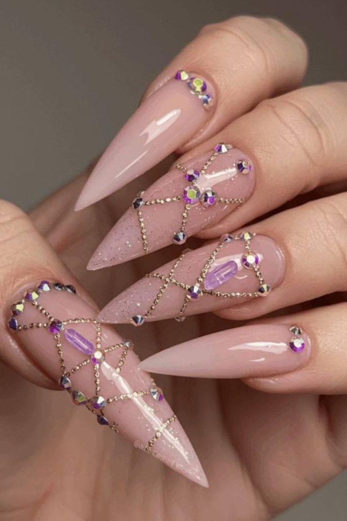 Blush pink crystal stiletto nails.