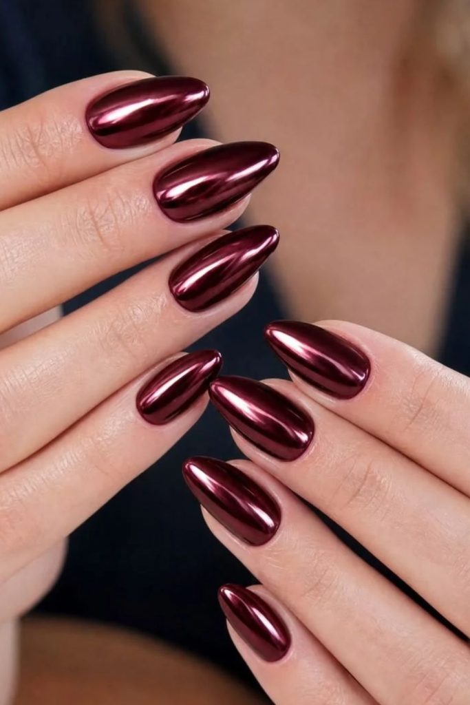 Reflective burgundy chrome manicure design