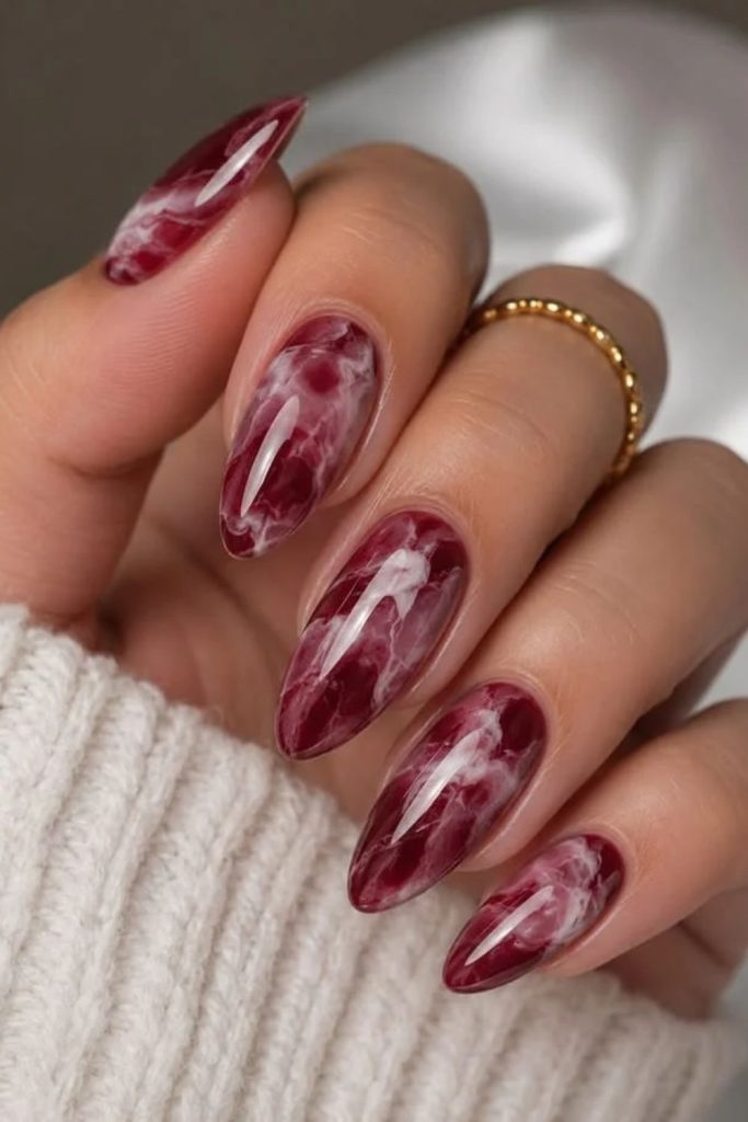Burgundy marble nails with gold