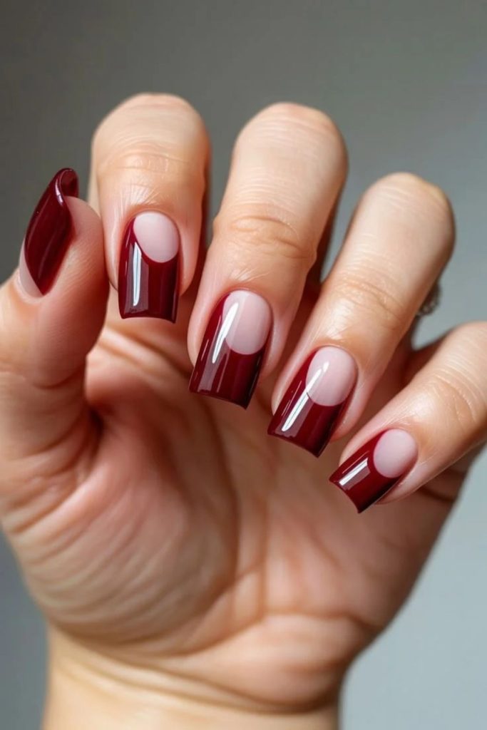 Burgundy negative space nail art
