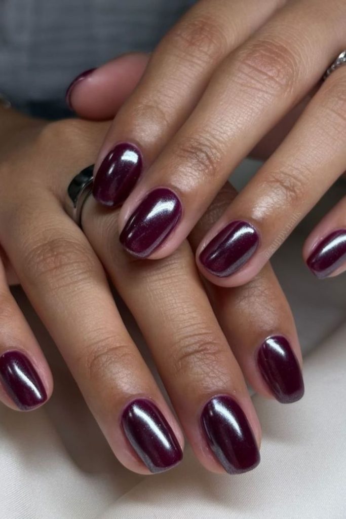 Short glossy candied plum nails.