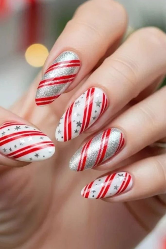 Colorful candy cane Christmas lights nails.