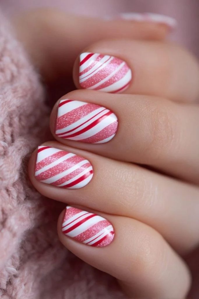 Sparkling red white candy cane glitter nails.