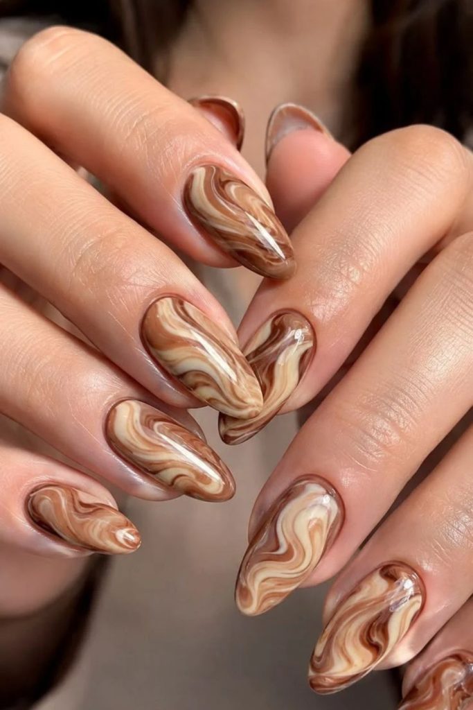 Caramel swirl tortoiseshell almond nails.