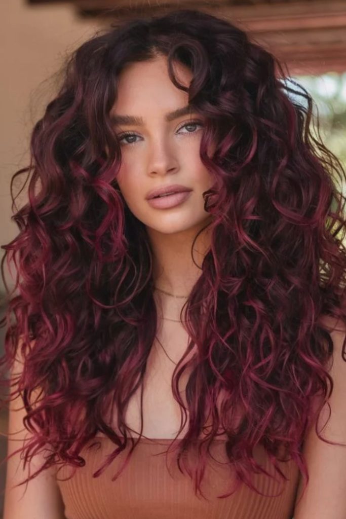 Cherry burgundy voluminous curly hair