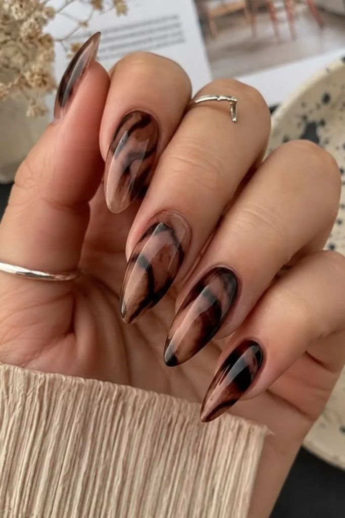 Chocolate marble tortoiseshell nail design.