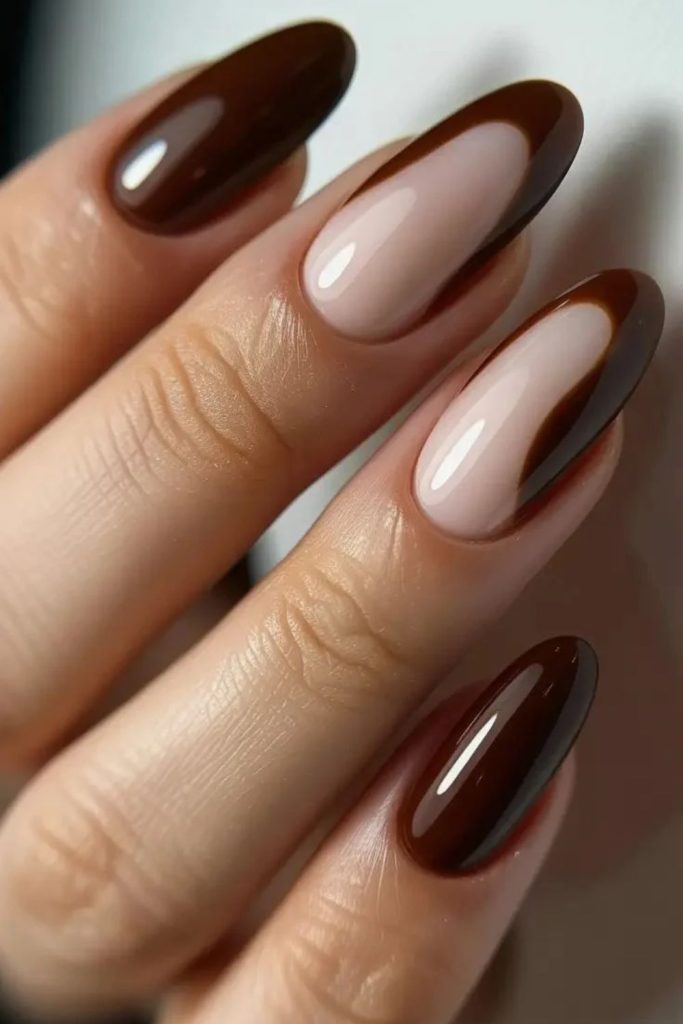 Truffle brown nails with nude tips.