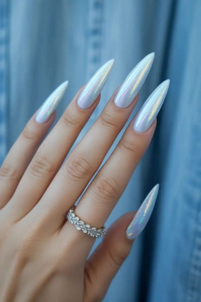 Icy silver chrome stiletto nails.