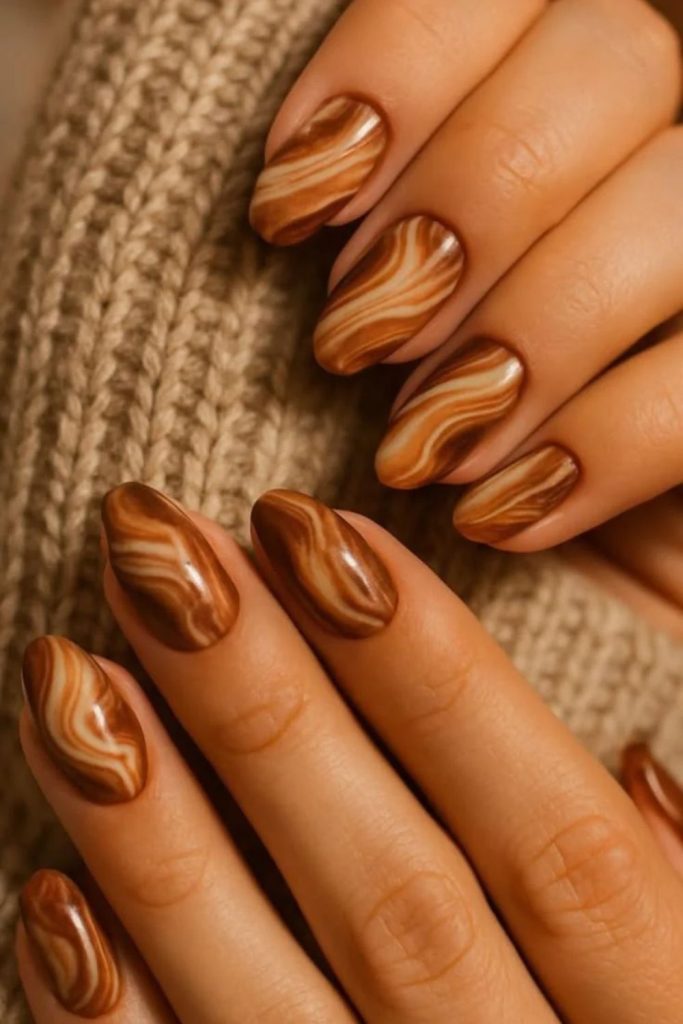 Cocoa nails with cinnamon stick accents.