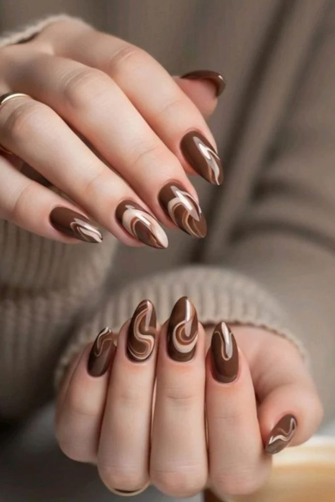 Chocolate nails with creamy cocoa swirls.