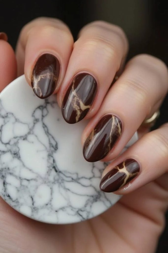Marble cocoa nails with creamy latte swirls.
