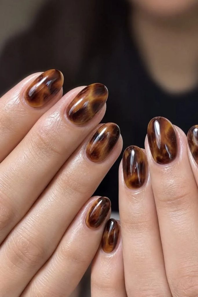 Coffee brown tortoiseshell cozy nail design.