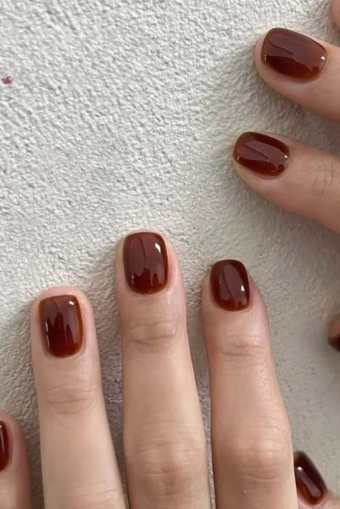 Glossy cola brown jelly nails.