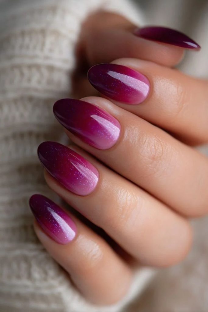Glowing cranberry aura nail design