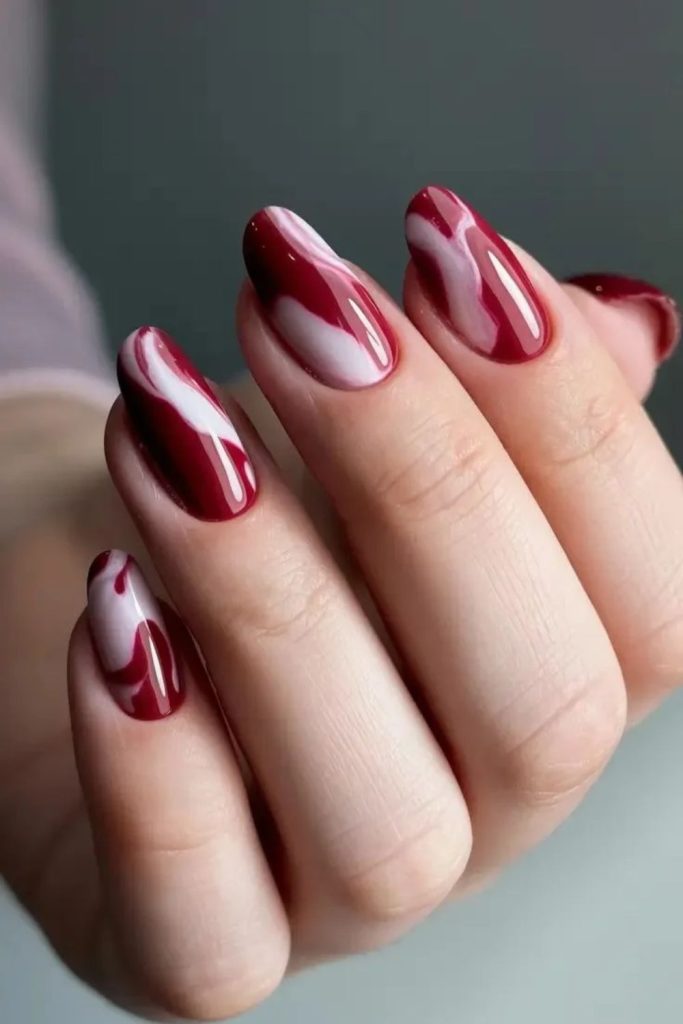 Nude cranberry swirl nail art