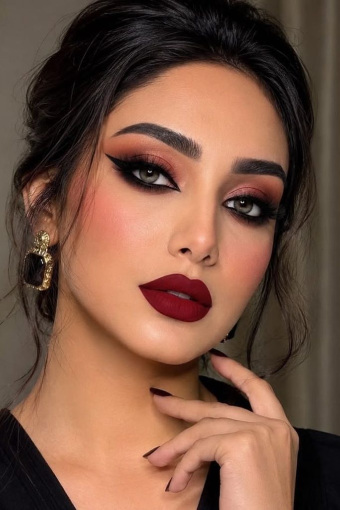 Crimson burgundy dramatic siren eye look.