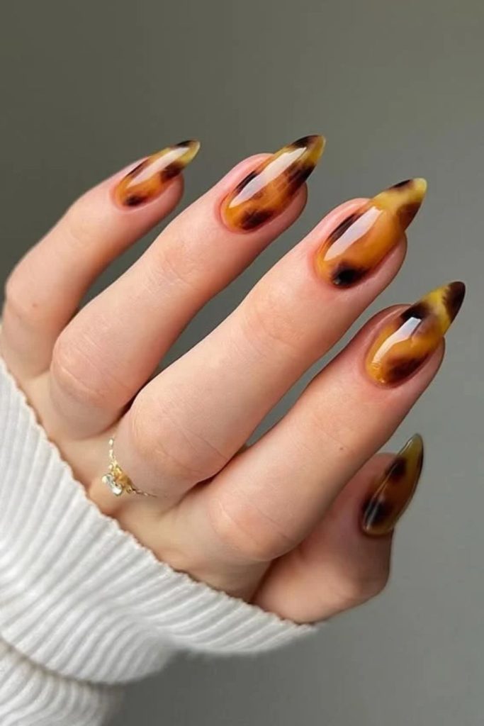 Dark honey tortoiseshell glossy manicure.