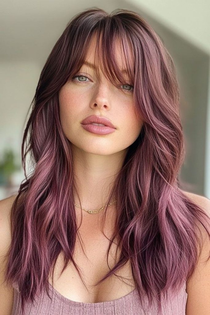Dusty plum hair with muted mauve.