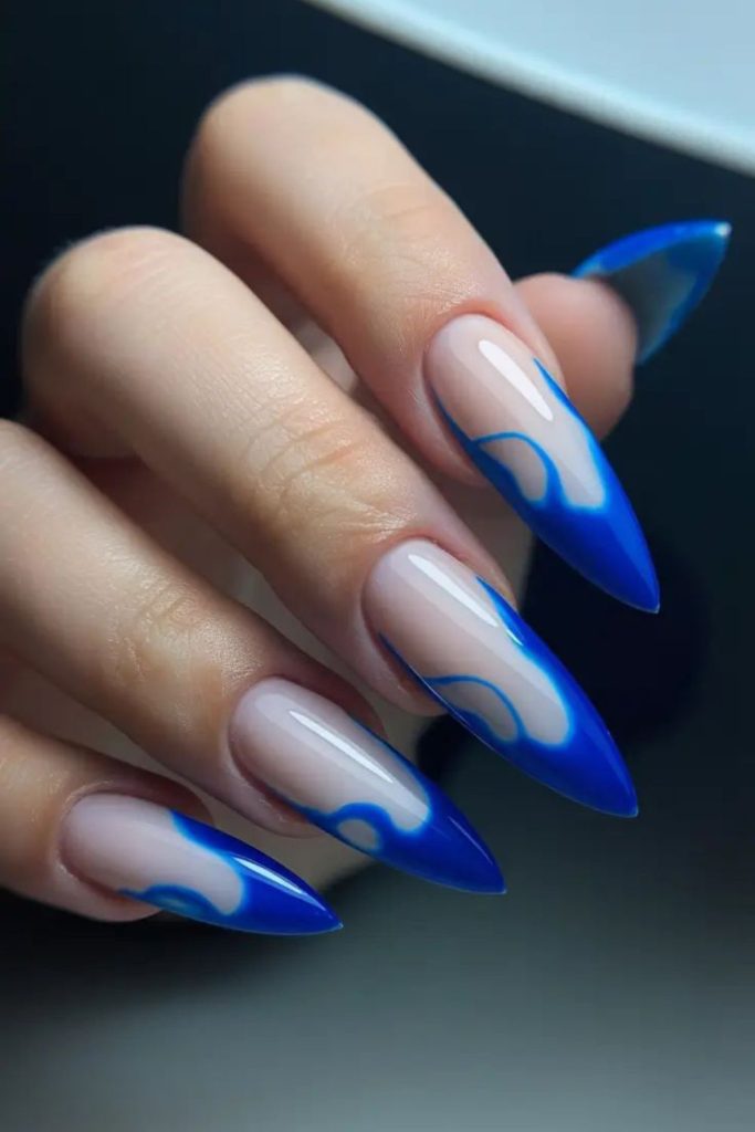 Electric blue graphic stiletto nails.