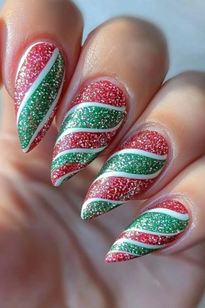 Emerald green candy swirl nail design.