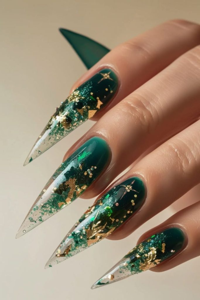 Emerald green gold stiletto nails.