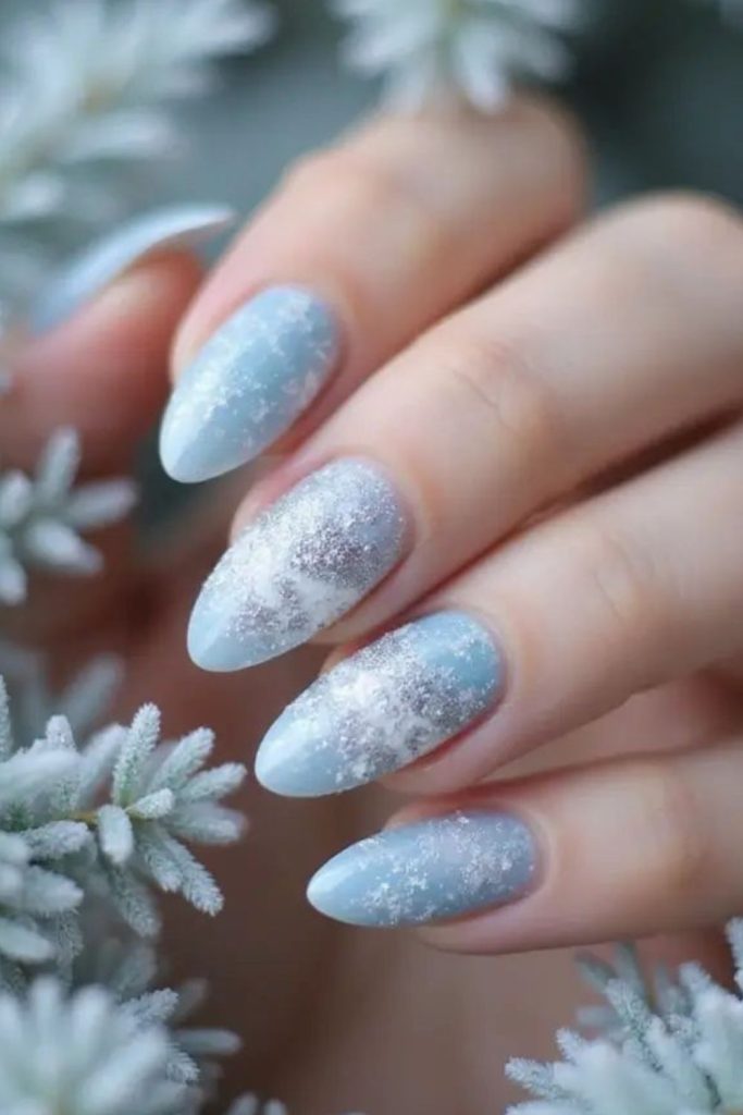 Enchanted blue silver snowflake nails.