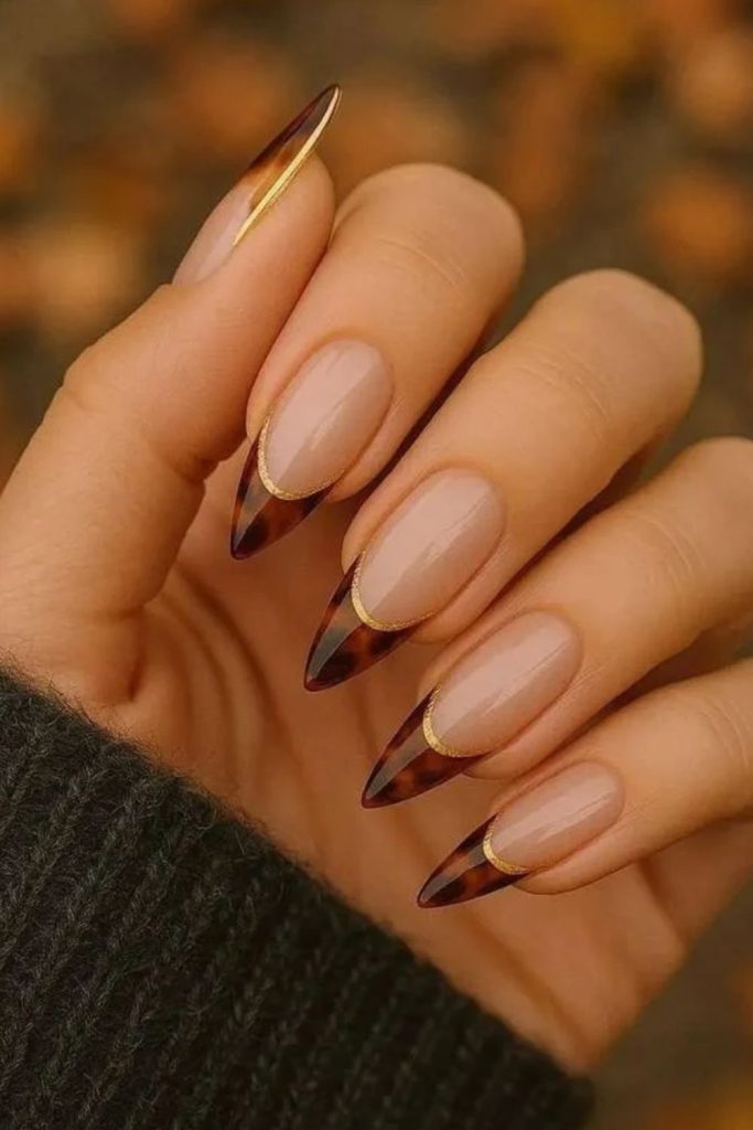 Espresso tortoiseshell French tip manicure.