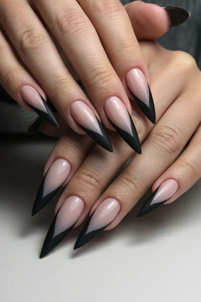 Black French tip stiletto nails.