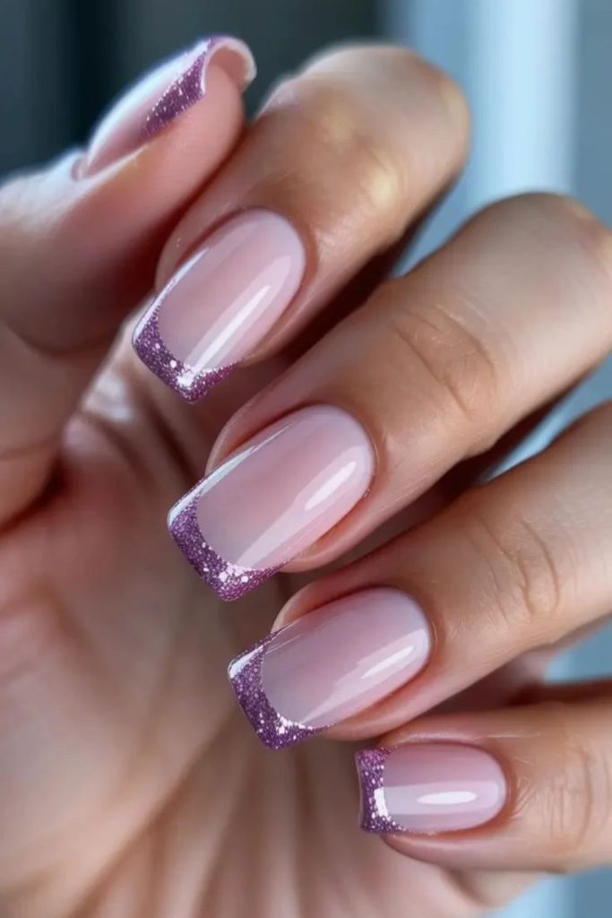 Frosted plum French tip nails.