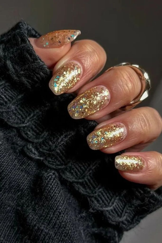 Glittering gold aura nude nails