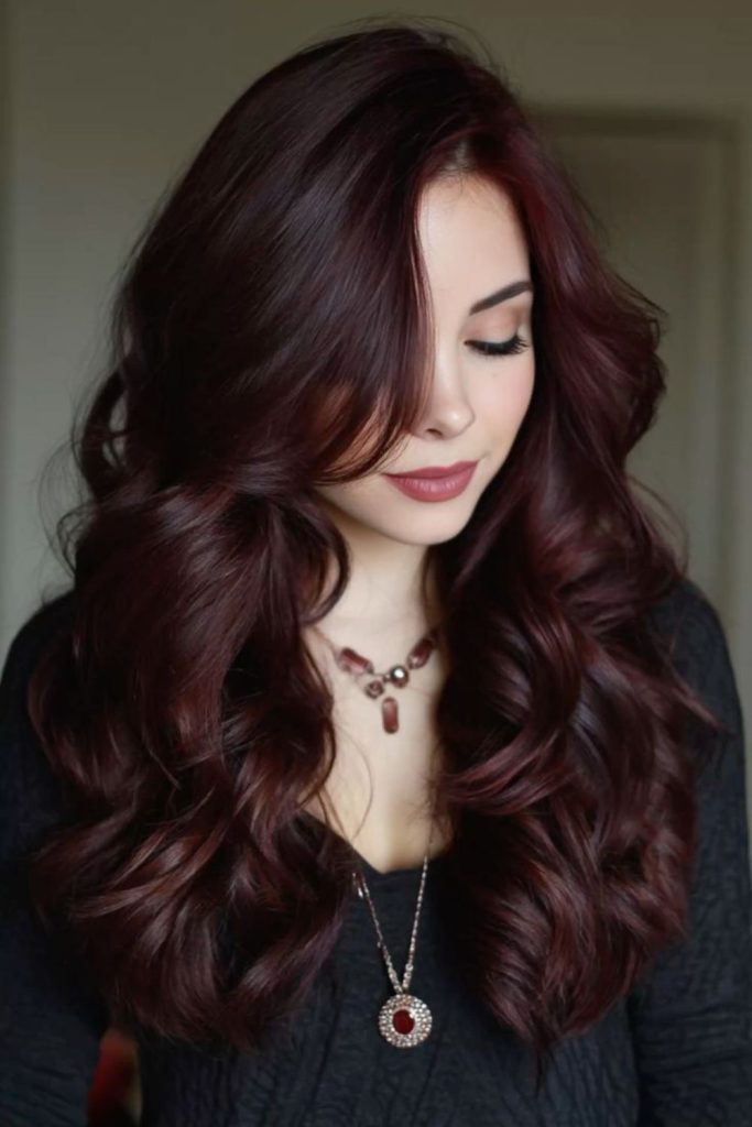 Glossy mahogany noir hair with red.