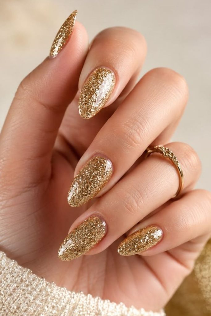 Golden glitter luxe manicure design