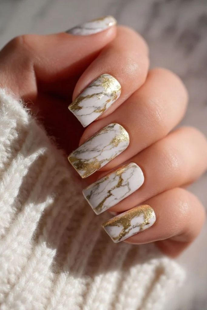Golden glitter marble nail design