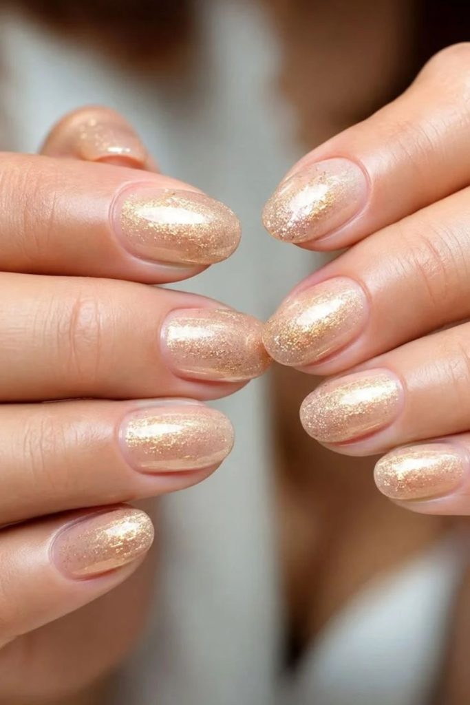 Golden stardust veil nude nails