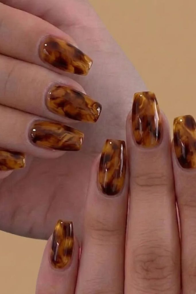 Honey amber tortoiseshell glossy manicure.