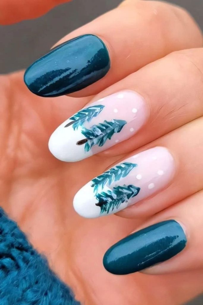 Icy teal Christmas tree nail design.