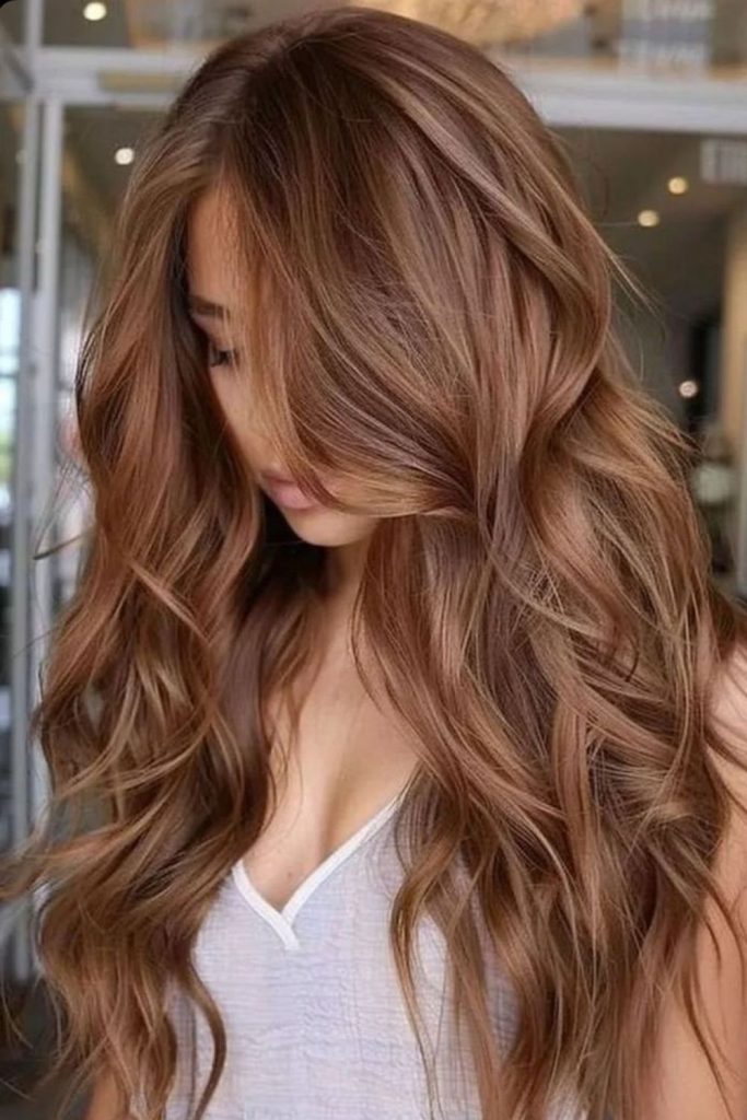 Maple bronde hair with golden caramel tones.