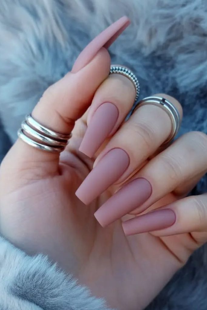 Matte mauve coffin nails with edges.