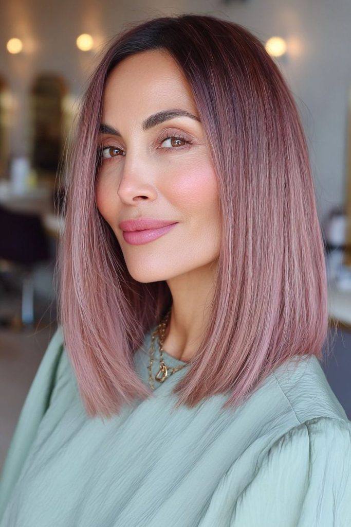 Mauve rose gold hair with waves.